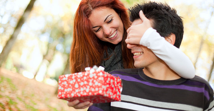 Girl giving a gift to the boy