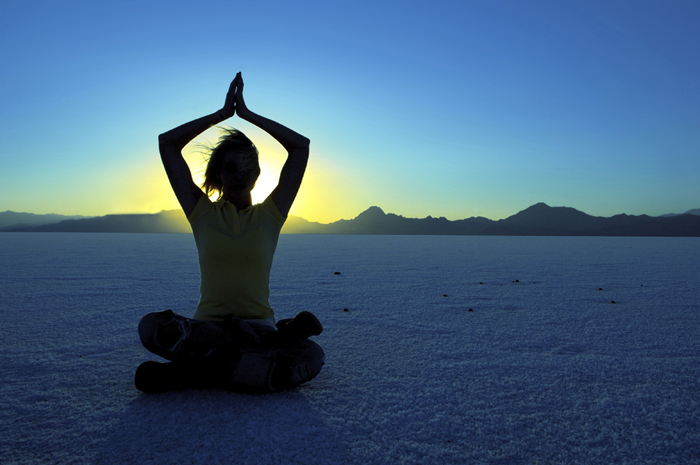 Woman practicing yoga outdoors