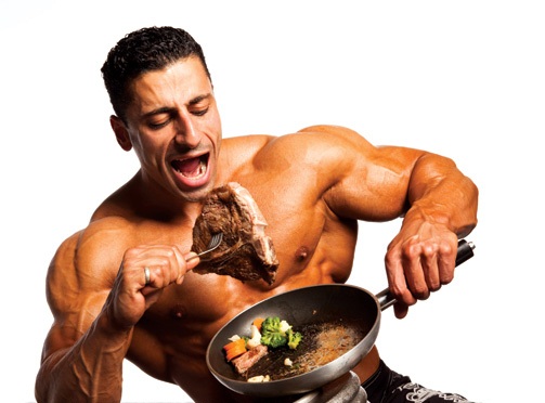 Muscular man eating meat only
